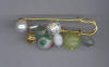 White Cloisonn, Serpentine, & Aventurine Kilt Sprit Pin